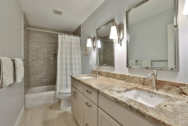 8750 E Kemper Rd, Symmes Twp, OH 45249 - full bathroom with shower / tub combo with curtain, double vanity, and toilet