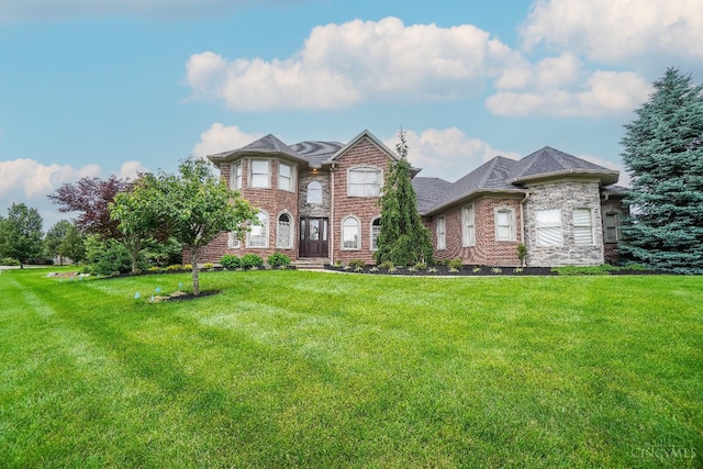 4625 Guildford Dr, West Chester, OH 45069 - view of front of property with a front yard and brick siding