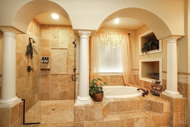 4625 Guildford Dr, West Chester, OH 45069 - bathroom with a garden tub, a shower stall, and decorative columns