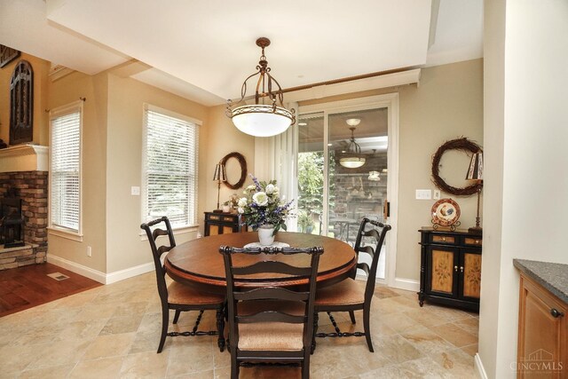 4625 Guildford Dr, West Chester, OH 45069 - dining room featuring baseboards and a stone fireplace