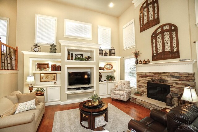 4625 Guildford Dr, West Chester, OH 45069 - living room with a stone fireplace and dark wood-style flooring