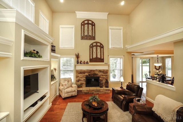 4625 Guildford Dr, West Chester, OH 45069 - living area with a fireplace, a towering ceiling, dark wood-style flooring, and recessed lighting