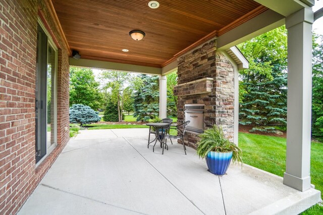 4625 Guildford Dr, West Chester, OH 45069 - view of patio / terrace with an outdoor stone fireplace