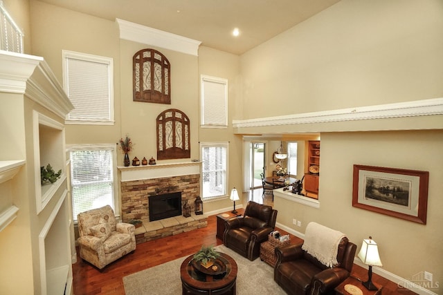 4625 Guildford Dr, West Chester, OH 45069 - living area with a fireplace, a towering ceiling, wood finished floors, baseboards, and recessed lighting
