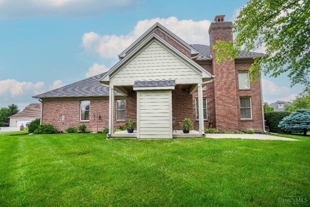 4625 Guildford Dr, West Chester, OH 45069 - view of front of house with a front yard and brick siding