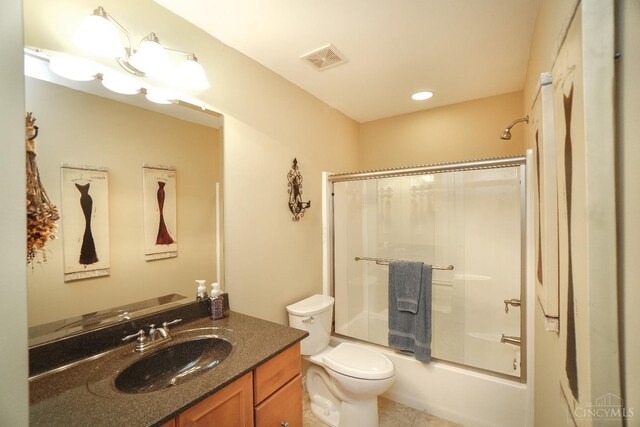 4625 Guildford Dr, West Chester, OH 45069 - bathroom featuring vanity, toilet, combined bath / shower with glass door, and tile patterned floors