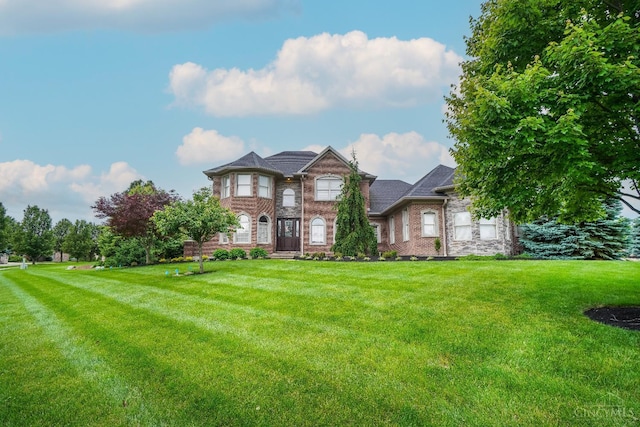 4625 Guildford Dr, West Chester, OH 45069 - view of front of property with a front yard and brick siding