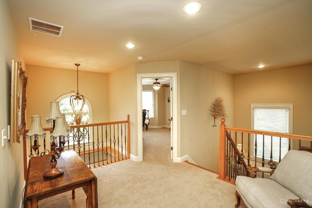 4625 Guildford Dr, West Chester, OH 45069 - hall with an upstairs landing, carpet, baseboards, recessed lighting, and a chandelier