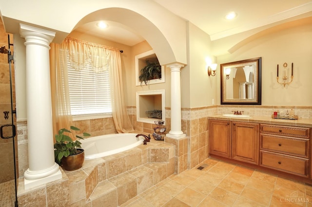4625 Guildford Dr, West Chester, OH 45069 - bathroom with decorative columns, a garden tub, tile walls, vanity, and a shower stall