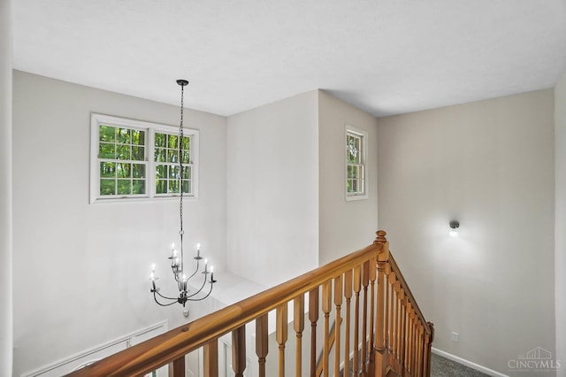 2193 Phillips Rd, Union Twp, OH 45036 - hall with a chandelier, an upstairs landing, plenty of natural light, and carpet floors