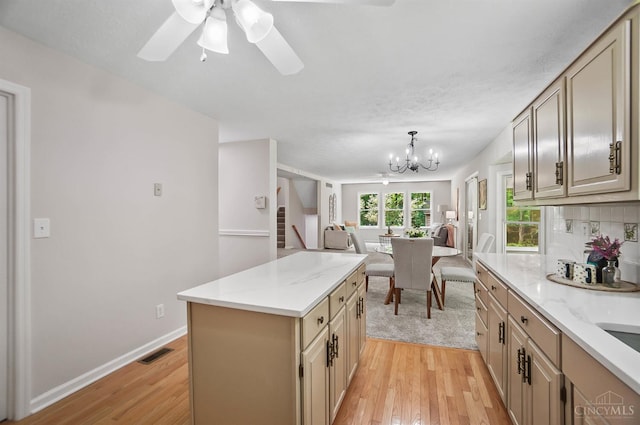2193 Phillips Rd, Union Twp, OH 45036 - kitchen with open floor plan, light wood-type flooring, a kitchen island, and a chandelier
