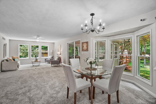 2193 Phillips Rd, Union Twp, OH 45036 - dining area with carpet floors, a textured ceiling, and a chandelier