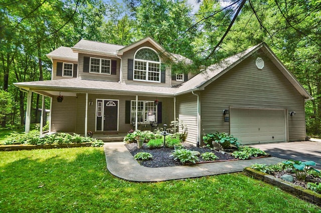 2193 Phillips Rd, Union Twp, OH 45036 - view of front of property with covered porch, concrete driveway, a front yard, and roof with shingles