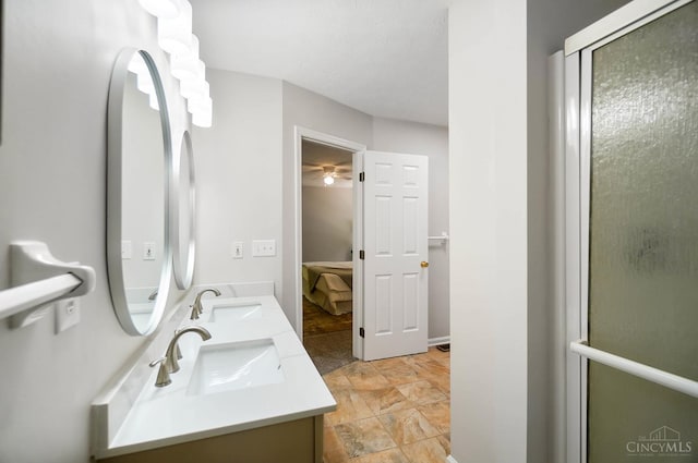 2193 Phillips Rd, Union Twp, OH 45036 - full bath with double vanity, connected bathroom, and a shower with shower door