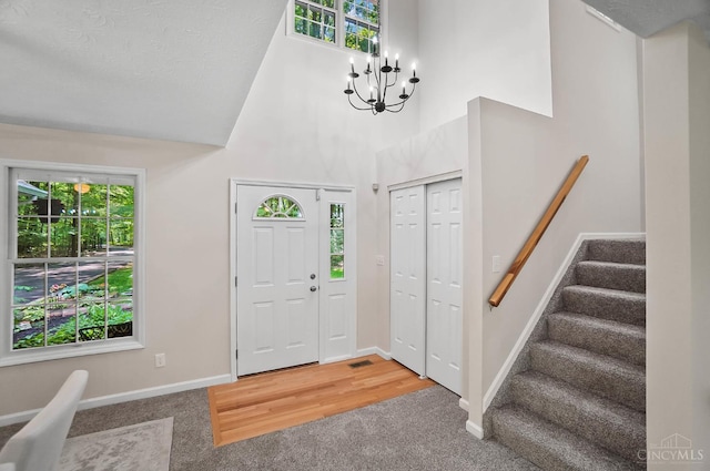 2193 Phillips Rd, Union Twp, OH 45036 - carpeted foyer with healthy amount of natural light, a towering ceiling, stairway, and a chandelier