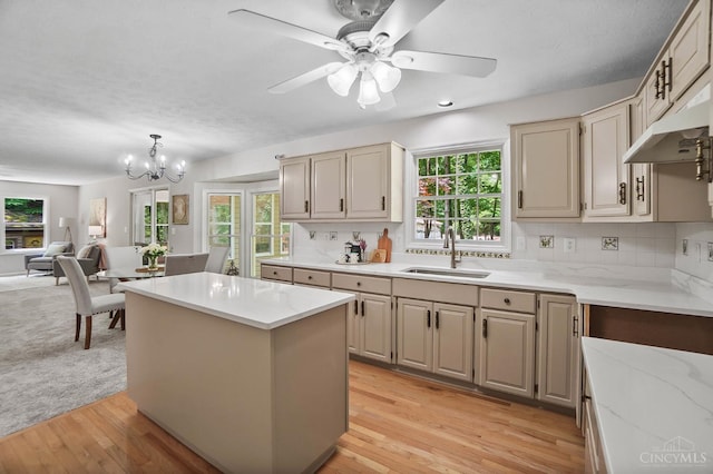 2193 Phillips Rd, Union Twp, OH 45036 - kitchen with plenty of natural light, a chandelier, under cabinet range hood, and a kitchen island