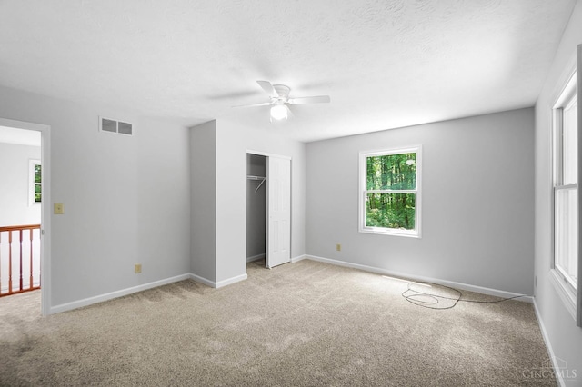 2193 Phillips Rd, Union Twp, OH 45036 - unfurnished bedroom with carpet flooring, a closet, and a ceiling fan