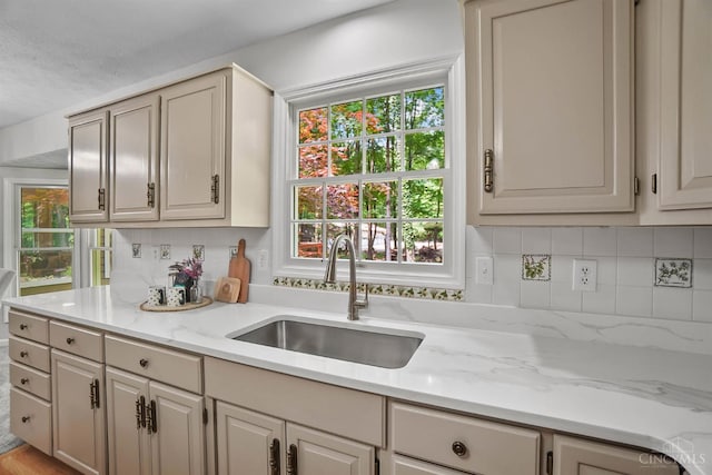 2193 Phillips Rd, Union Twp, OH 45036 - kitchen with backsplash, healthy amount of natural light, and light stone counters