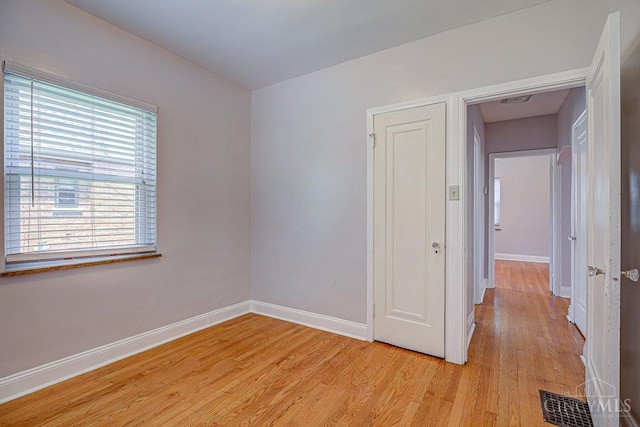 3947 Ruth Ln, Cheviot, OH 45211 - empty room featuring baseboards and light wood-style floors