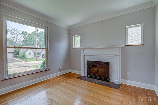3947 Ruth Ln, Cheviot, OH 45211 - unfurnished living room with ornamental molding, a fireplace, and light wood-type flooring