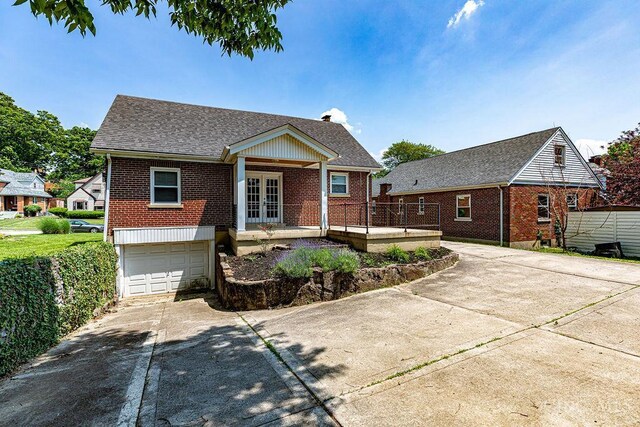 3947 Ruth Ln, Cheviot, OH 45211 - single story home with french doors, brick siding, concrete driveway, and a garage