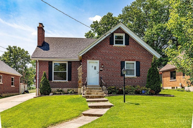 3947 Ruth Ln, Cheviot, OH 45211 - bungalow-style home with entry steps, a chimney, brick siding, a front lawn, and a shingled roof
