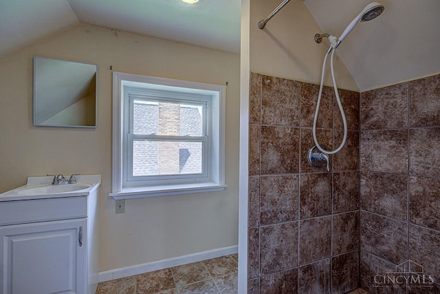 3947 Ruth Ln, Cheviot, OH 45211 - bathroom with lofted ceiling, vanity, and tiled shower
