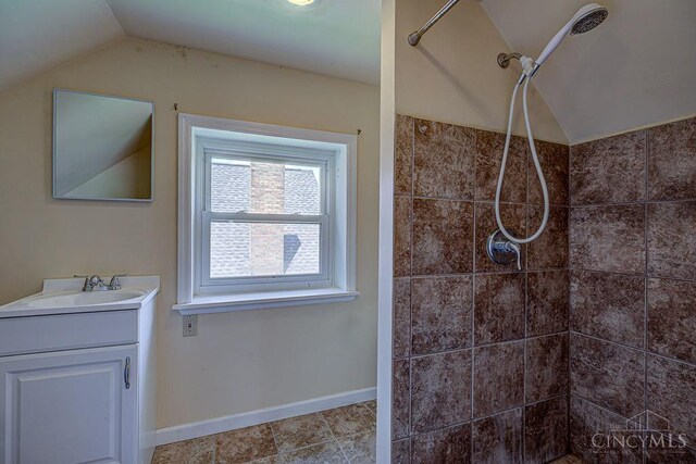 3947 Ruth Ln, Cheviot, OH 45211 - full bath with lofted ceiling, vanity, and tiled shower