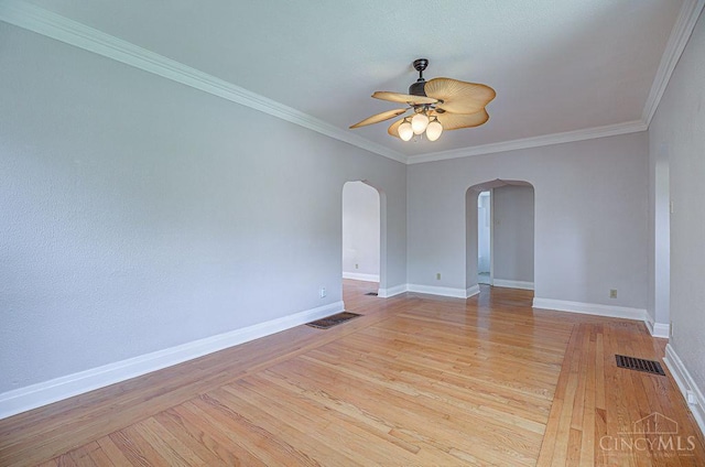 3947 Ruth Ln, Cheviot, OH 45211 - empty room with arched walkways, ceiling fan, light wood-type flooring, and crown molding