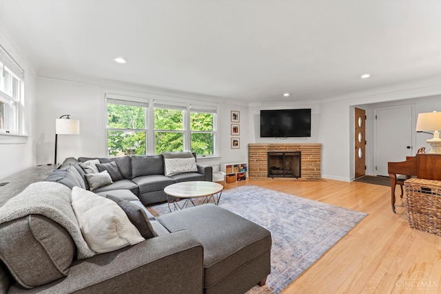 6530 Cliff Ridge Ln, Columbia Twp, OH 45213 - living area featuring healthy amount of natural light, light wood-style floors, recessed lighting, and a brick fireplace
