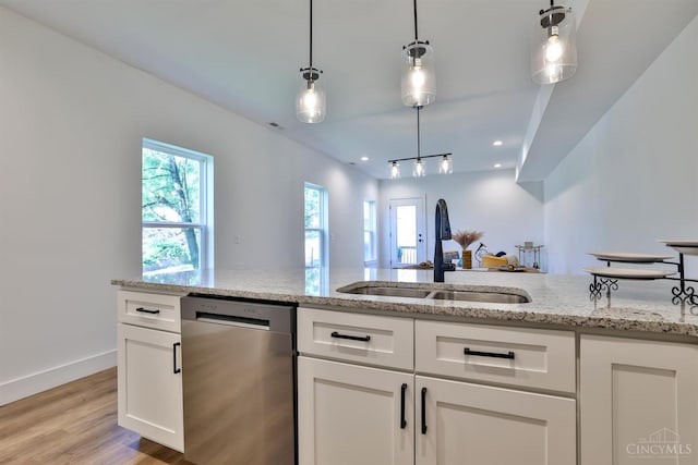 2351 Concord St, Cincinnati, OH 45206 - kitchen featuring dishwasher, light wood-style floors, white cabinetry, decorative light fixtures, and light stone countertops