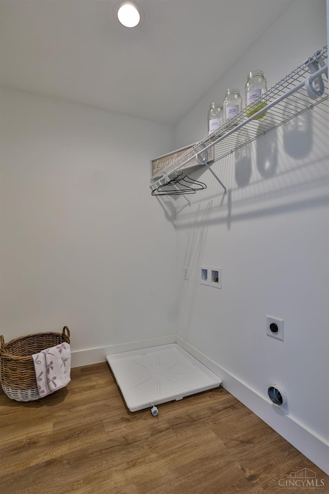 2351 Concord St, Cincinnati, OH 45206 - washroom with electric dryer hookup, washer hookup, and wood finished floors