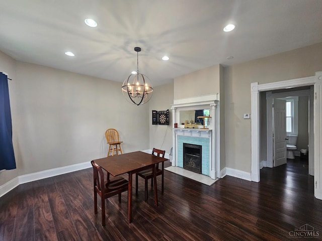 2002 Clarion Ave, Cincinnati, OH 45207 - dining space with a chandelier, wood finished floors, a fireplace with flush hearth, and recessed lighting