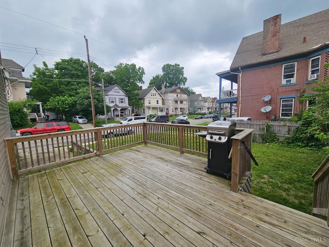 2002 Clarion Ave, Cincinnati, OH 45207 - wooden deck featuring area for grilling, a residential view, and a yard