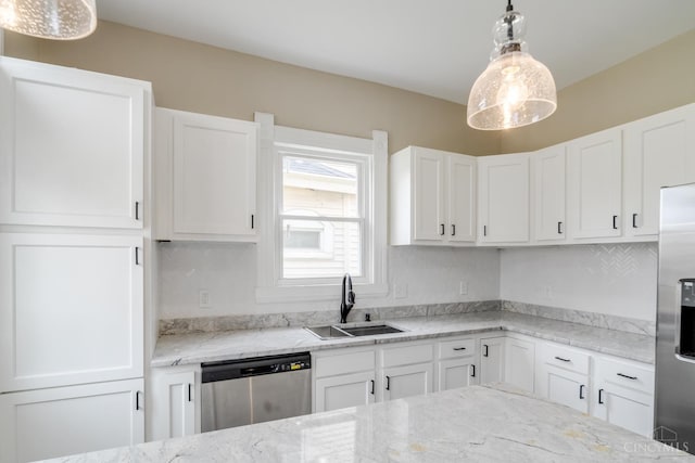 2002 Clarion Ave, Cincinnati, OH 45207 - kitchen with stainless steel appliances, white cabinetry, light stone counters, and pendant lighting