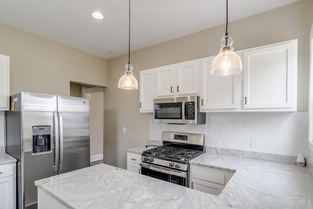 2002 Clarion Ave, Cincinnati, OH 45207 - kitchen with appliances with stainless steel finishes, tasteful backsplash, white cabinetry, pendant lighting, and recessed lighting