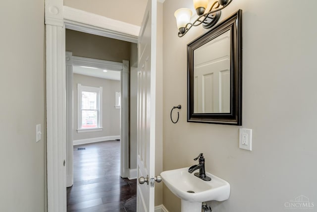 2002 Clarion Ave, Cincinnati, OH 45207 - bathroom featuring wood finished floors and a chandelier