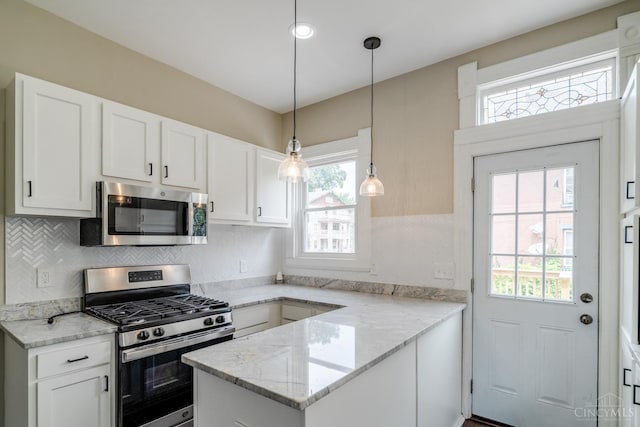 2002 Clarion Ave, Cincinnati, OH 45207 - kitchen with stainless steel appliances, healthy amount of natural light, and white cabinets