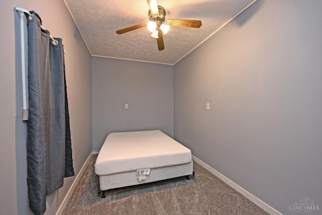 9660 N Dixie Hwy, Franklin Twp, OH 45005 - carpeted bedroom featuring baseboards, a textured ceiling, a ceiling fan, and ornamental molding