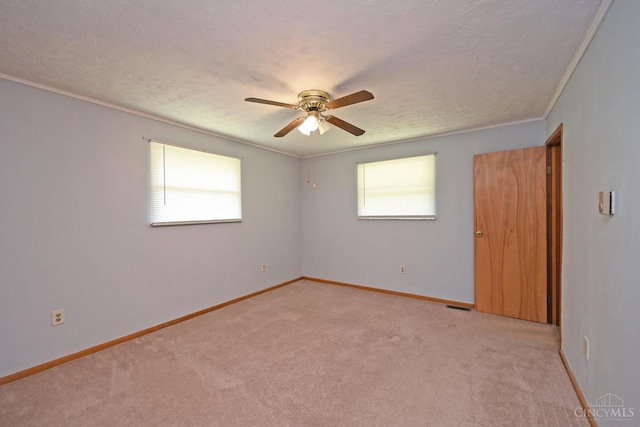9660 N Dixie Hwy, Franklin Twp, OH 45005 - unfurnished bedroom with light carpet, a textured ceiling, baseboards, ceiling fan, and crown molding