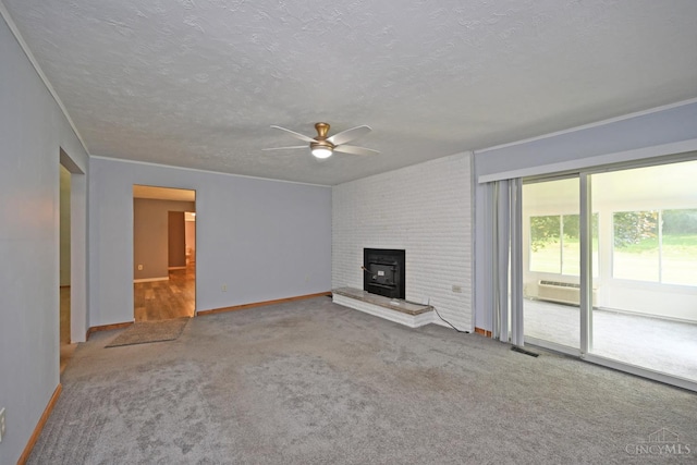 9660 N Dixie Hwy, Franklin Twp, OH 45005 - unfurnished living room with ceiling fan, carpet floors, baseboards, a wood stove, and a textured ceiling