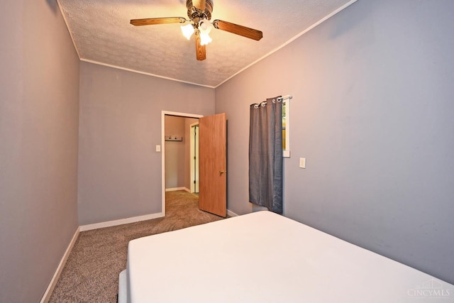 9660 N Dixie Hwy, Franklin Twp, OH 45005 - unfurnished bedroom with carpet floors, a textured ceiling, baseboards, a ceiling fan, and crown molding