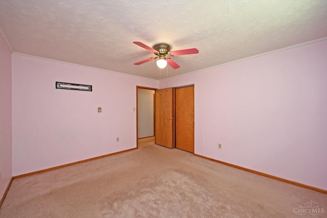 9660 N Dixie Hwy, Franklin Twp, OH 45005 - unfurnished bedroom featuring baseboards, light colored carpet, ornamental molding, ceiling fan, and a closet