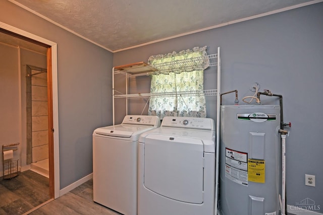 9660 N Dixie Hwy, Franklin Twp, OH 45005 - laundry room with water heater, washing machine and dryer, wood finished floors, ornamental molding, and baseboards