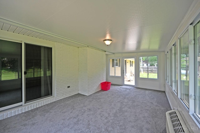 9660 N Dixie Hwy, Franklin Twp, OH 45005 - unfurnished sunroom with carpet flooring and brick wall