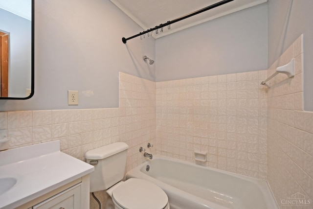 9660 N Dixie Hwy, Franklin Twp, OH 45005 - full bath with shower / tub combination, toilet, tile walls, vanity, and a wainscoted wall