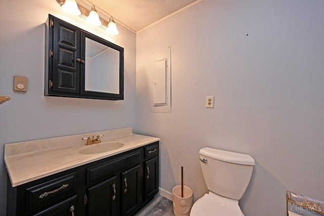 9660 N Dixie Hwy, Franklin Twp, OH 45005 - bathroom with vanity, toilet, crown molding, wood finished floors, and baseboards