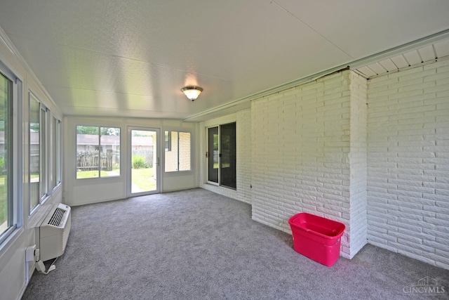 9660 N Dixie Hwy, Franklin Twp, OH 45005 - unfurnished sunroom with brick wall, carpet, and a wall mounted air conditioner