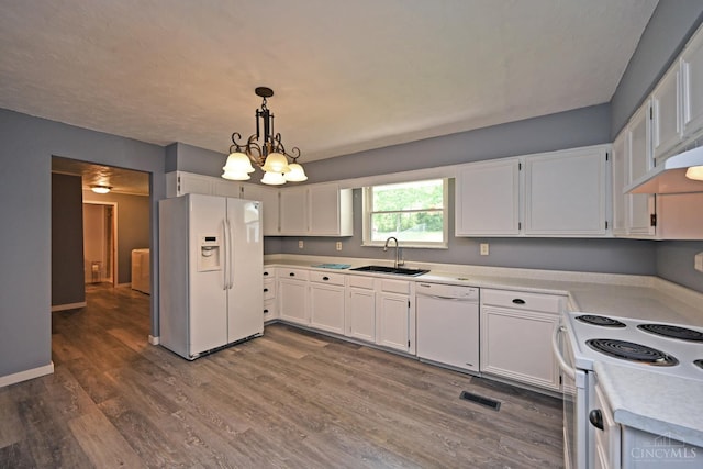 9660 N Dixie Hwy, Franklin Twp, OH 45005 - kitchen featuring white appliances, a sink, light countertops, white cabinetry, and dark wood finished floors