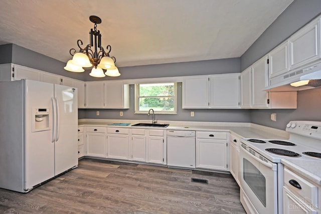 9660 N Dixie Hwy, Franklin Twp, OH 45005 - kitchen with white appliances, a sink, under cabinet range hood, and white cabinets